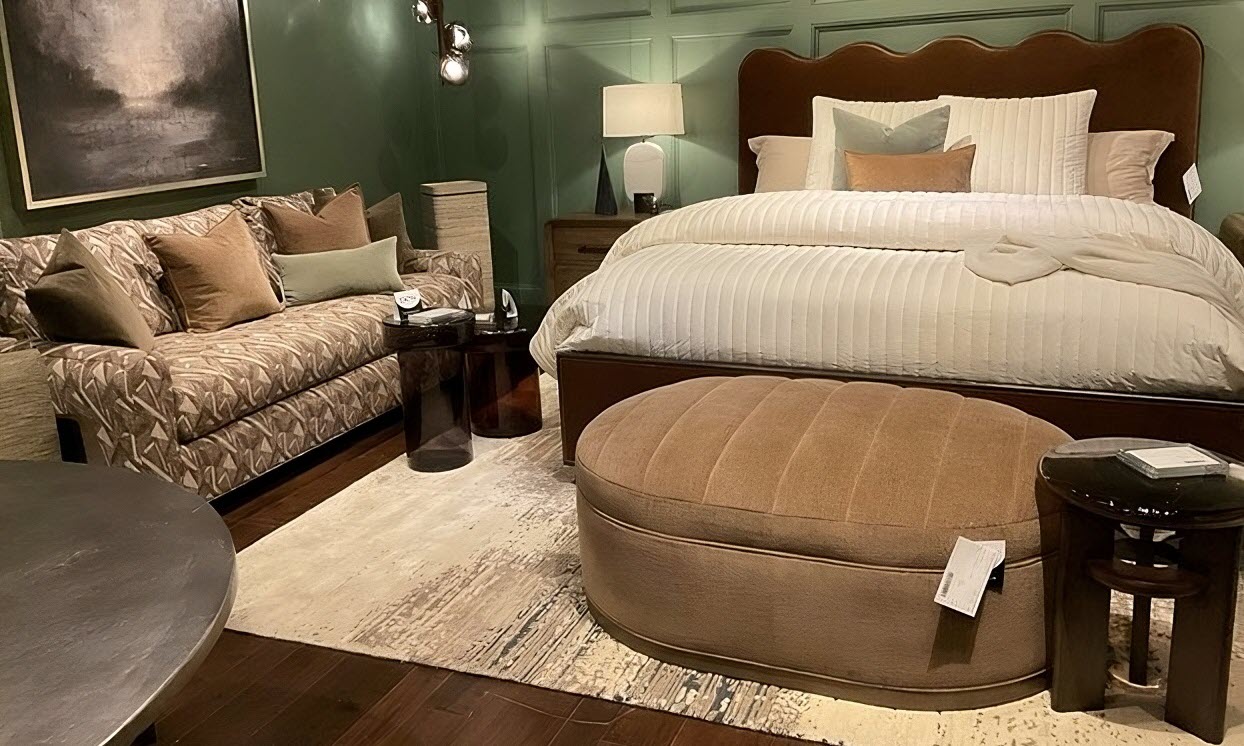 Bedroom with layered velvet, suede, and boucle fabrics in warm neutral tones and rich textures – Spring 2025 interior design trend