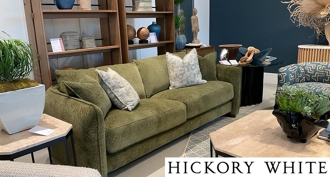 Hickory White olive green textured sofa with neutral accent pillows in an earthy, curated living room